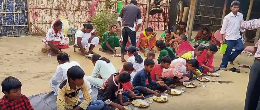 Children being served a meal by our team in India